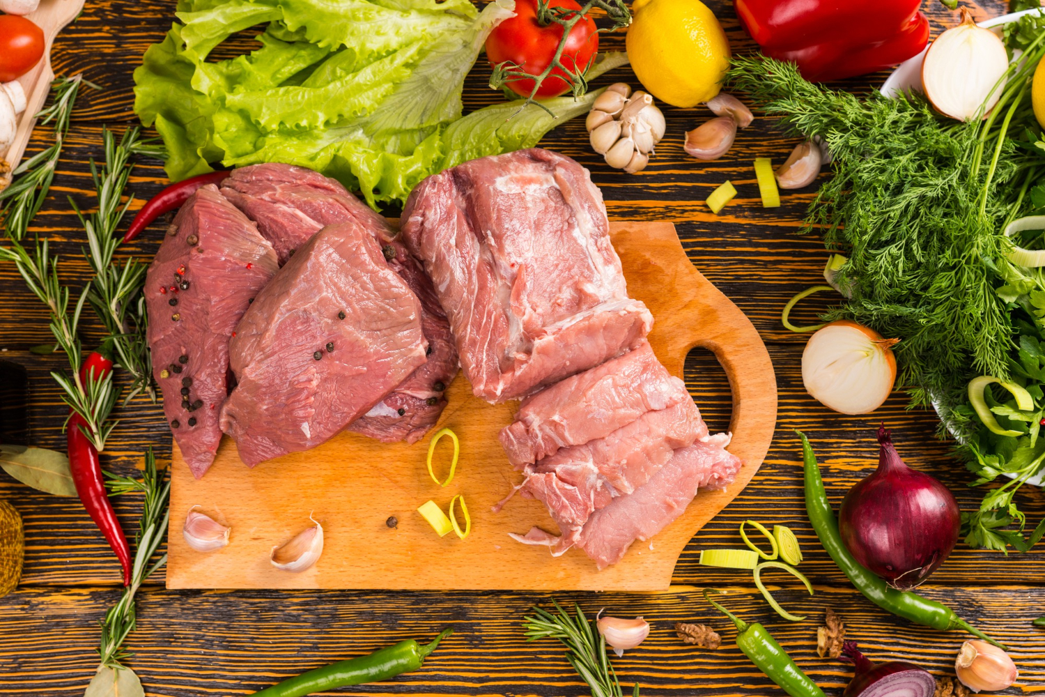 Close-up of tender, slow-cooked beef cheeks meat served with rich sauce over creamy mashed potatoes, garnished with fresh herbs.